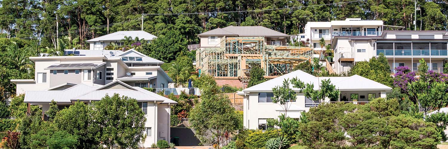 House under construction amongst other completed housing projects.