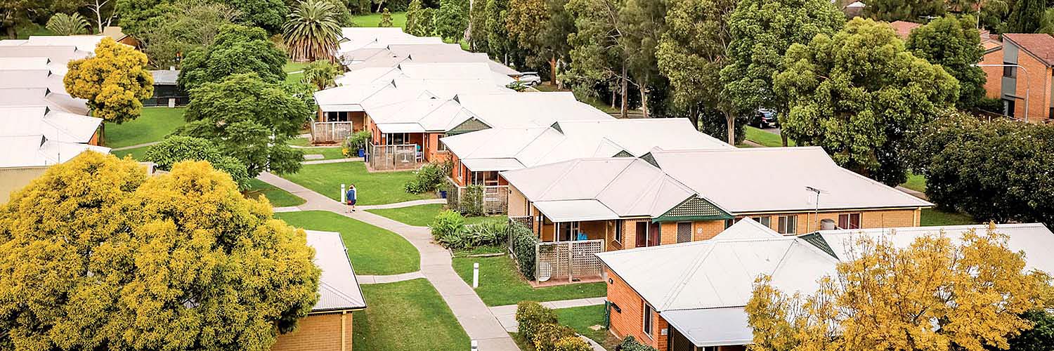 Small housing development with shared paths and gardens.