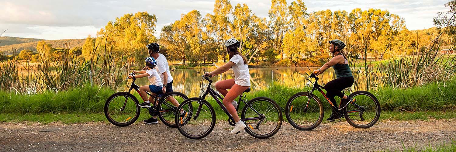 Famiy enjoying a day of cycling along the Wagirra Trail and Yindyamarra Sculpture Walk, West Albury. Credit: Destination NSW