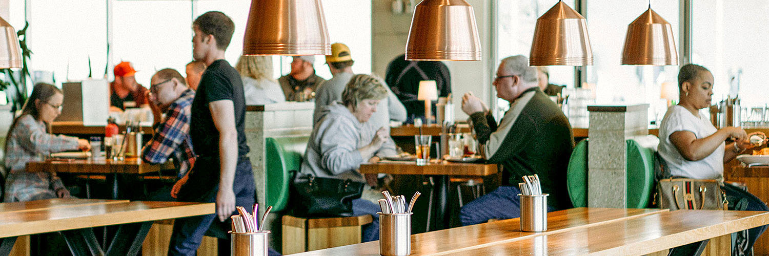 Modern café scene showing people dining - Energy NSW. Credit: NSW Department of Planning and Environment / Stock Photography