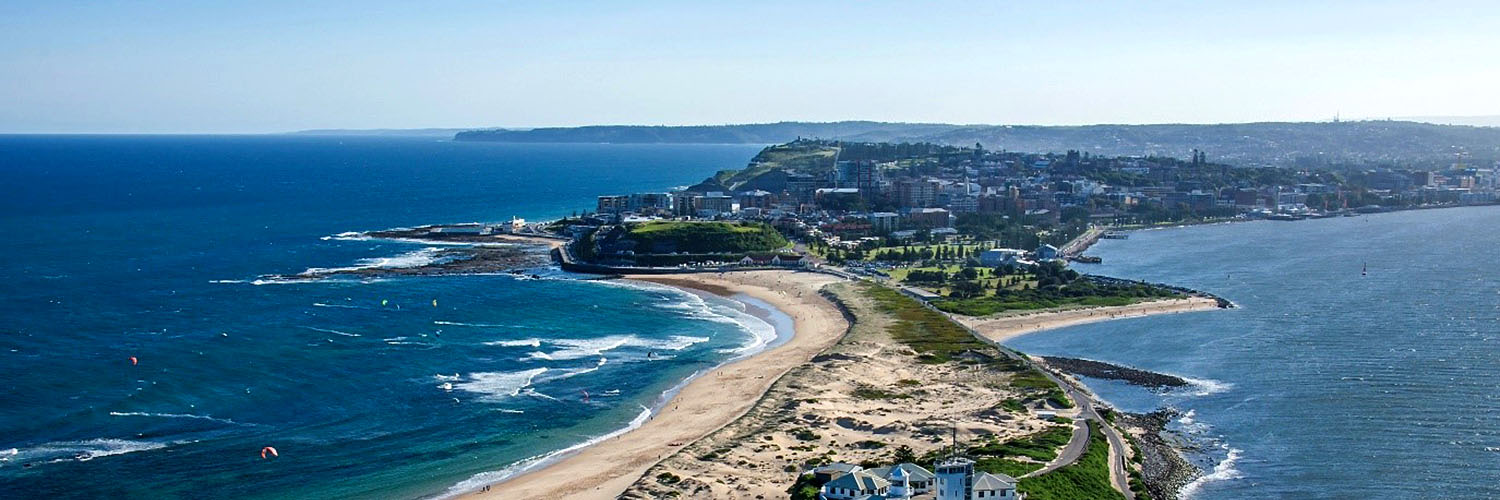 Coastal aerial of the southern end of Stockton Beach and Newcastle City.