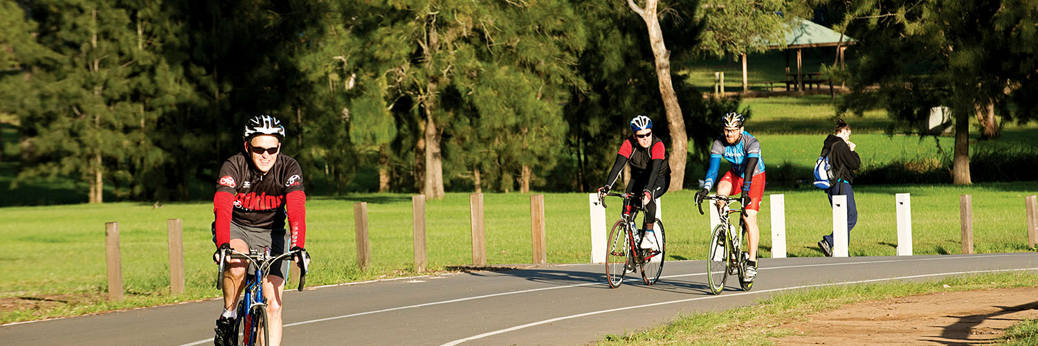 Cyclists riding in Parramatta Park.