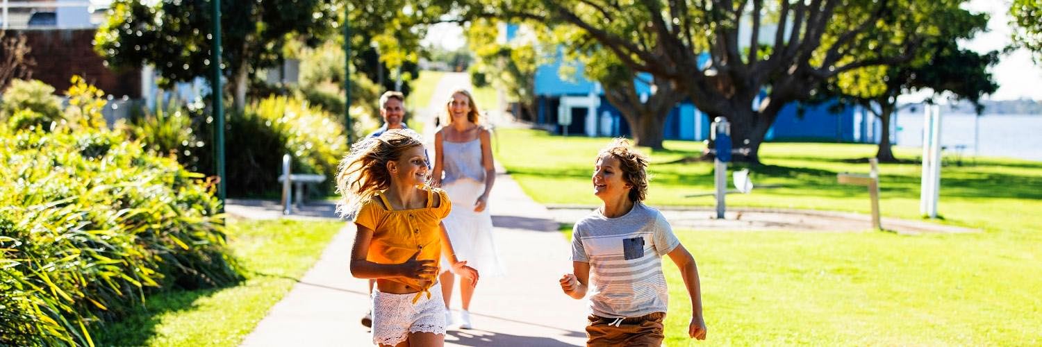 Family enjoying a self-guided walk along the Taree Heritage Walk, Taree. Credit: Destination NSW