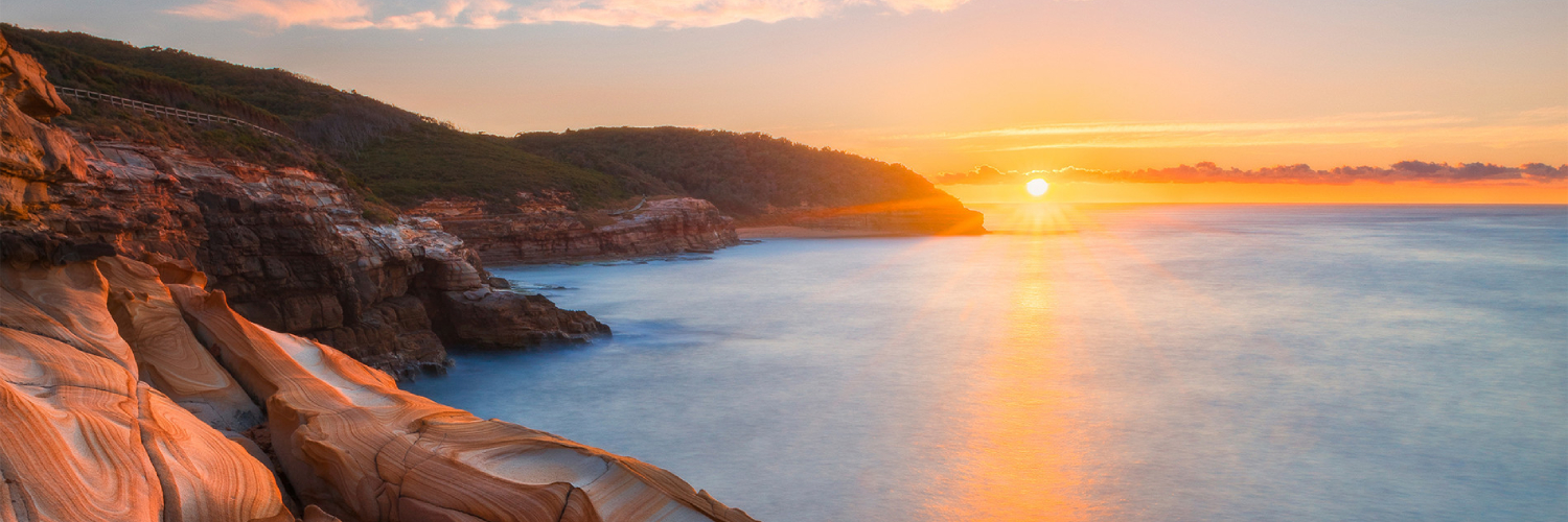 Sunrise over the tessellated pavement in Bouddi National Park. Credit: Destination NSW