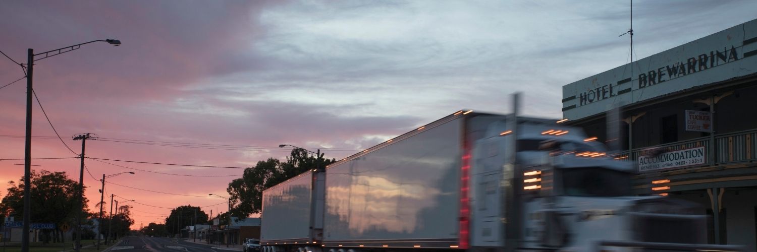 A truck drives down Kamilaroi Highway at sunrise in Brewarrina, NSW. Credit: NSW Department of Planning and Environment / Quentin Jones