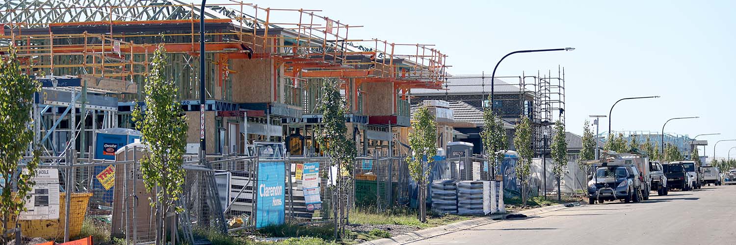Houses under construction in a new housing development area.