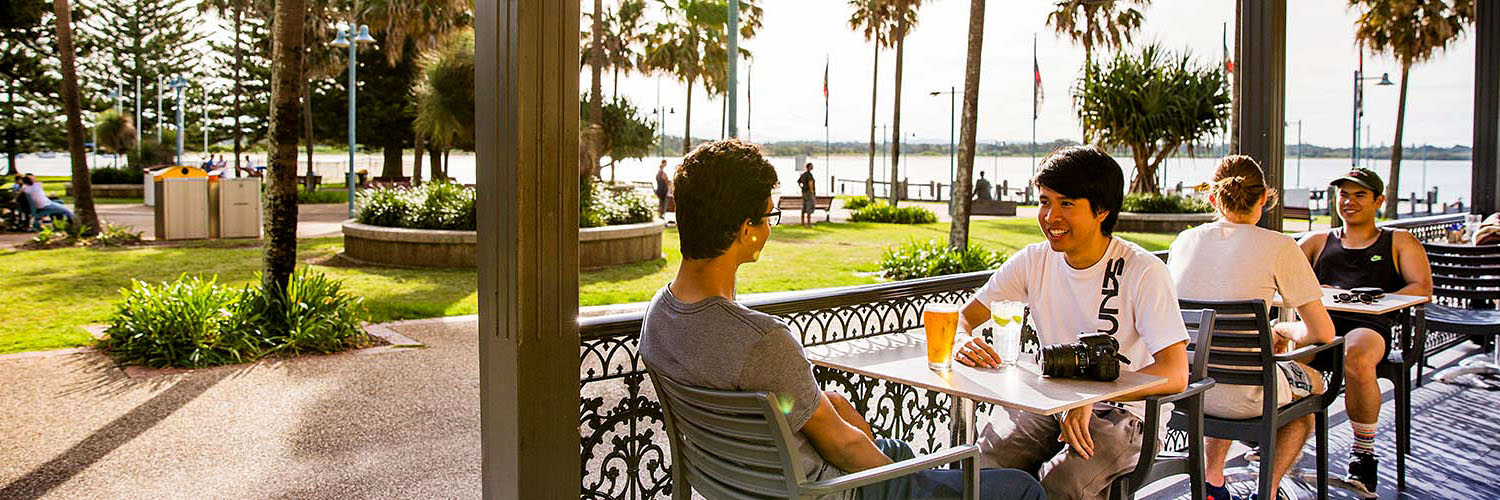 Friends enjoying afternoon drinks at The Beach House Restaurant and Bar, Port Macquarie. Credit: Destination NSW