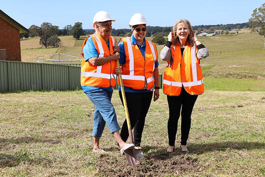 Three women turning sod at Bowraville Reserve