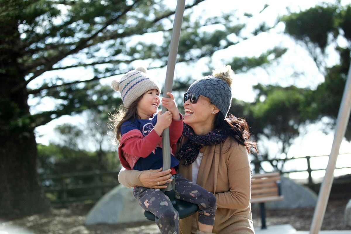 Mum holding daughter on Tathra Flying Fox