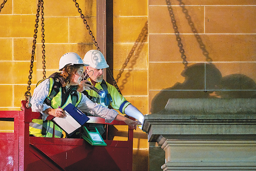 NSW Public Works Principal Heritage Architect Kate Napier and Heritage Stoneworks' Senior Stonemason Craig Miller assess condition and repairs. Credit: Michael Nicholson, 2018