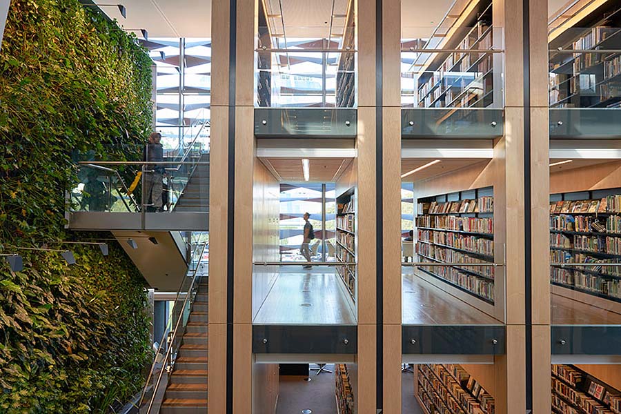 Better look and feel: Book shelves are located on three floor levels that open onto a three-storey central atrium. Image: GANSW