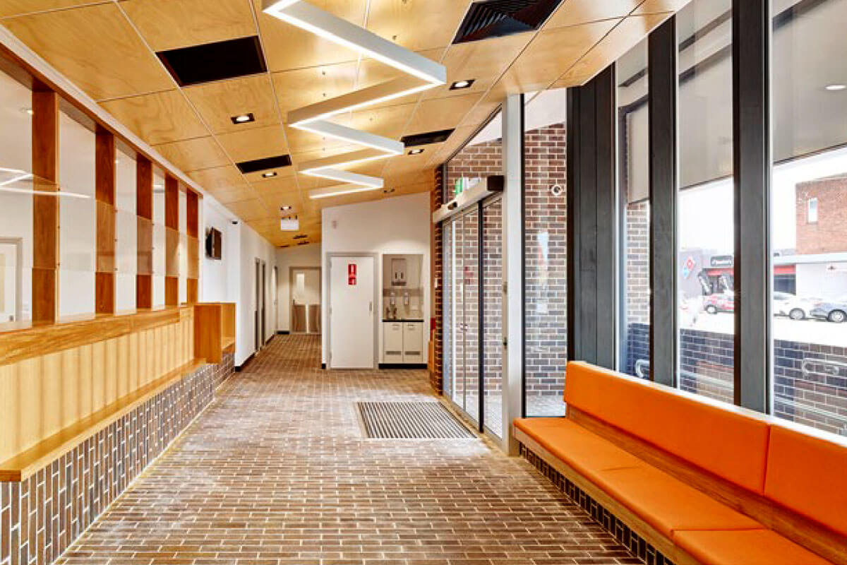 Brick paving made from local earth designates entry and waiting areas at Casino Aboriginal Medical Service. Credit: Toby Scott