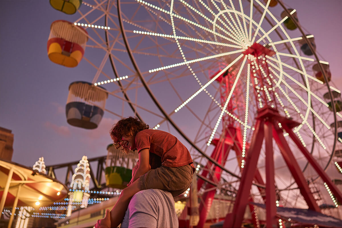 Family enjoying a day out at Luna Park Sydney, Milsons Point. Image credit: Destination NSW