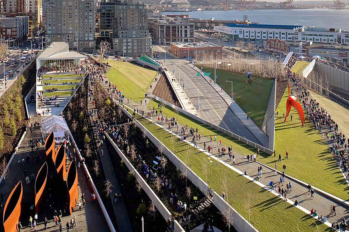 The Seattle Art Museum’s Olympic Sculpture Park bridges over a railway corridor and arterial road to reconnect the city to its harbour waterfront. Credit: Benjamin Benschneider