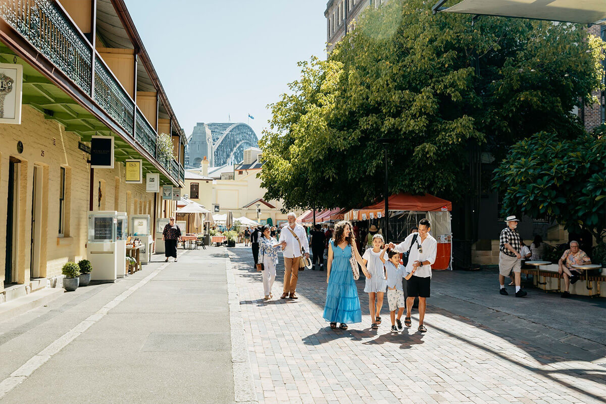 Family exploring The Rocks in Sydney. Image credit: Destination NSW