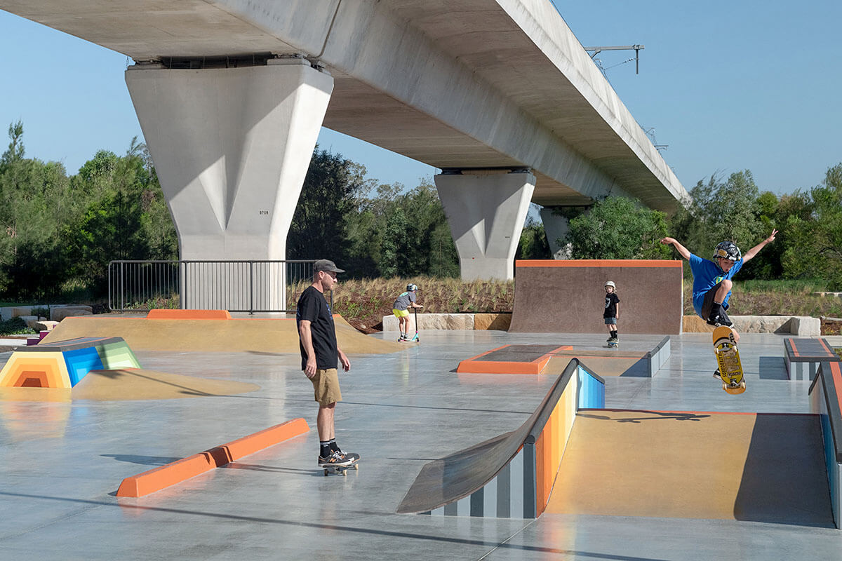 People skating under overpass at new park in Beaumont Hills. Credit: NSW Department of Planning, Housing and Infrastructure 
