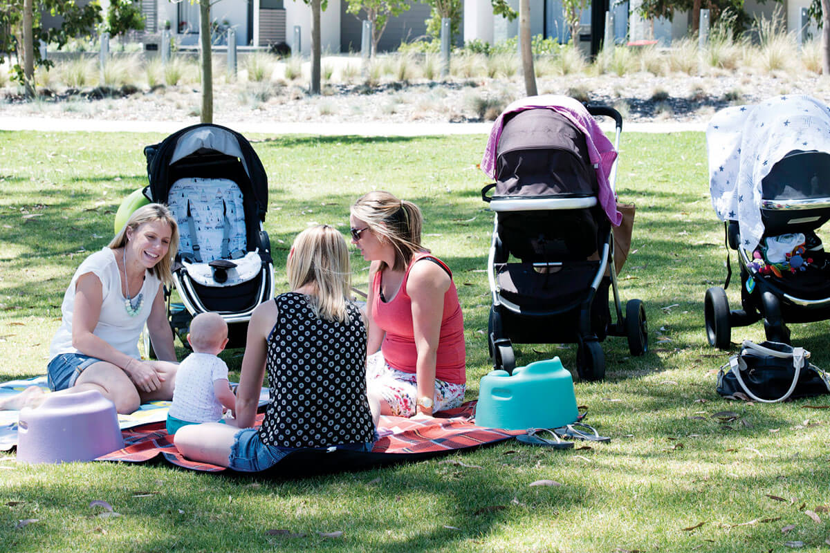 Mothers have a picnic in a park with their babies. Blacktown, NSW. Credit: NSW Department of Planning, Housing and Infrastructure / Sarah Rhodes