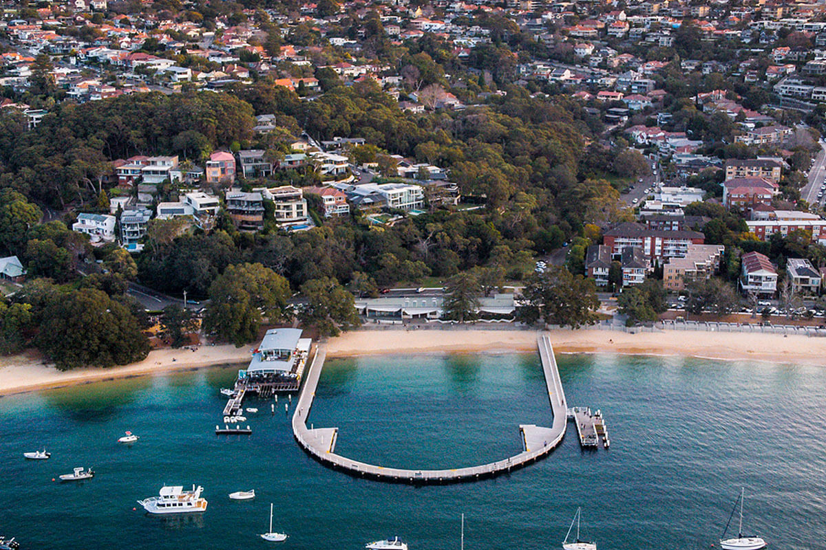 Aerial overlooking Balmoral Baths, Mosman NSW. Credit: Destination NSW