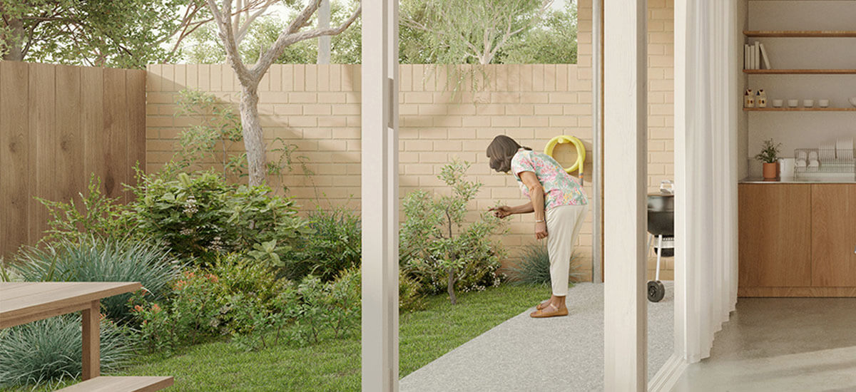 Row Homes 01 design by SAHA kitchen opens to private outdoor landscaped garden. Credit: Choi Render
