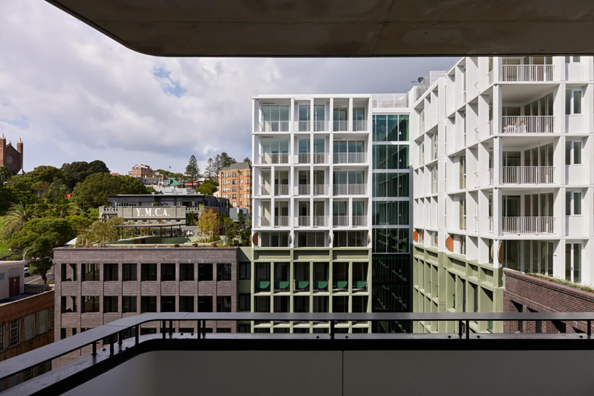 Mid-rise architectural apartments viewed from a mid-rise balcony. Credit: Tom Roe..