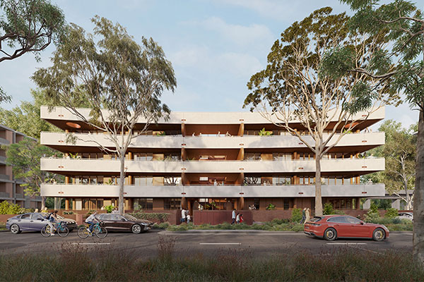 Street view of 4 storey apartment with warm white masonry.