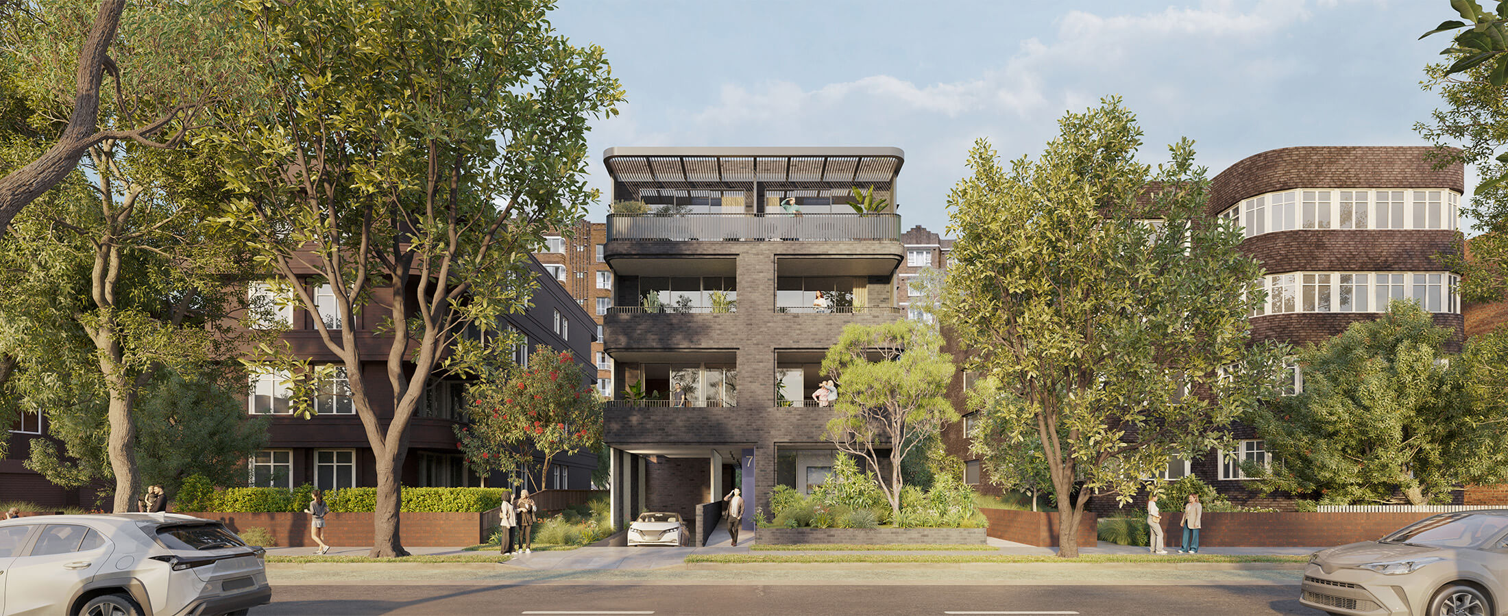 Street view of 4 storey apartment with two apartment blocks on left and right. 