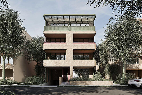 Street view of 4 storey apartment with light brown bricks. 