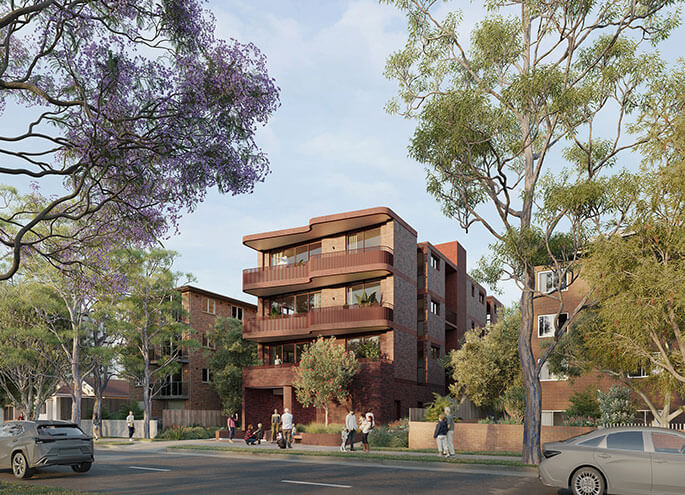 Angled street view of 4 storey apartment  with two apartment blocks on left and right. 