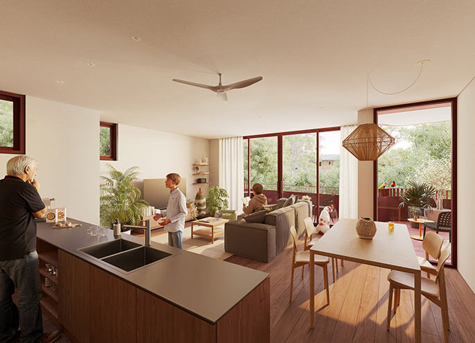 View into living room of apartment from the kitchen to the balcony with two people talking inside and another person sitting on the couch.