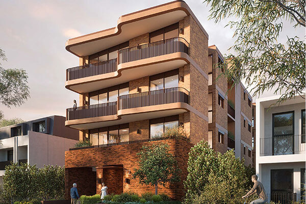Street view of 4 storey apartment with bricks.
