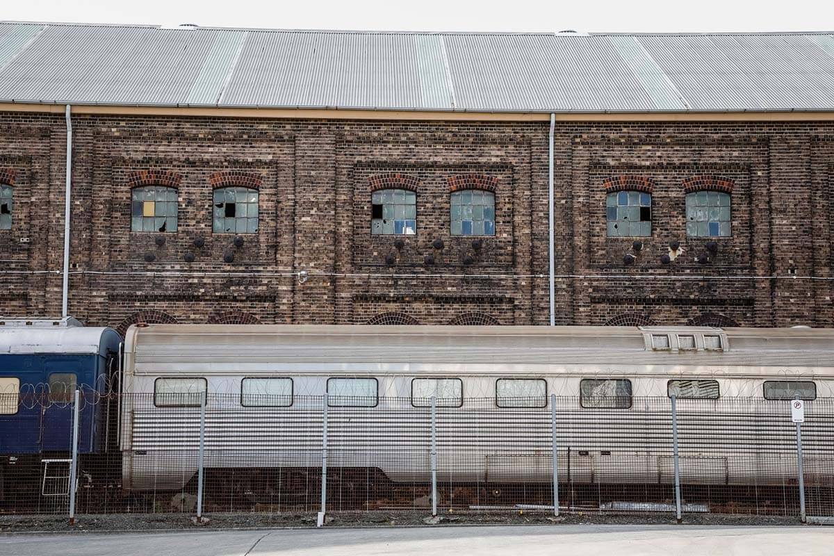 Train parked near old warehouse, Redfern NSW. Credit: NSW Department of Planning, Housing and Infrastructure / Salty Dingo